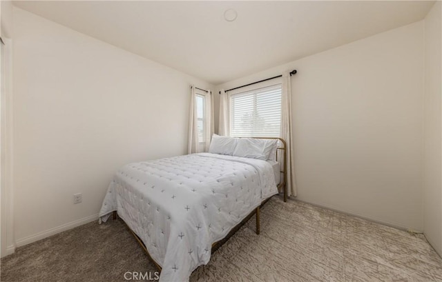 347 Carson Ct, Rialto, CA 92376 - carpeted bedroom featuring baseboards