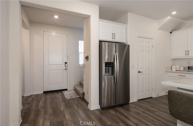 347 Carson Ct, Rialto, CA 92376 - kitchen featuring stainless steel refrigerator with ice dispenser, dark wood-type flooring, white cabinets, light countertops, and recessed lighting