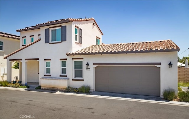 347 Carson Ct, Rialto, CA 92376 - view of front of property featuring a tile roof, stucco siding, and an attached garage