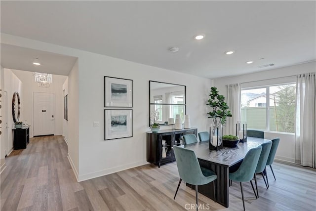 17148 Kent St, Hesperia, CA 92345 - dining space featuring a chandelier, light wood-style flooring, and recessed lighting
