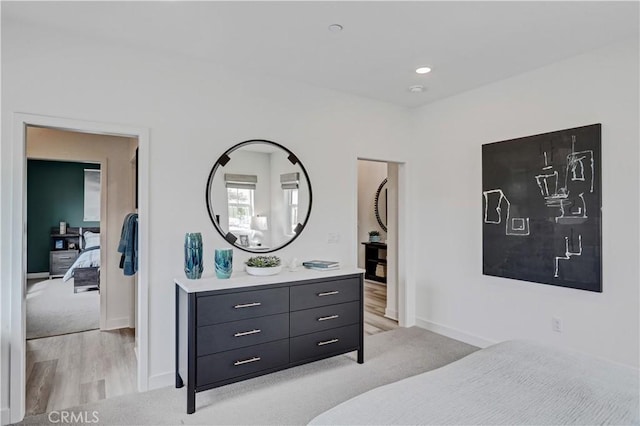 17148 Kent St, Hesperia, CA 92345 - bedroom featuring light colored carpet and light wood-style floors