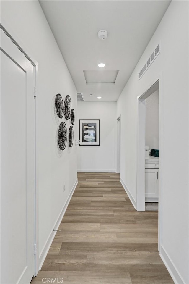 17148 Kent St, Hesperia, CA 92345 - hall with light wood-type flooring, recessed lighting, and attic access