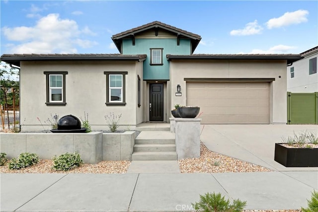 17148 Kent St, Hesperia, CA 92345 - view of front of property featuring driveway, a garage, and stucco siding