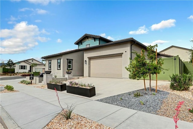 17148 Kent St, Hesperia, CA 92345 - view of front of home with a garage, stucco siding, and concrete driveway