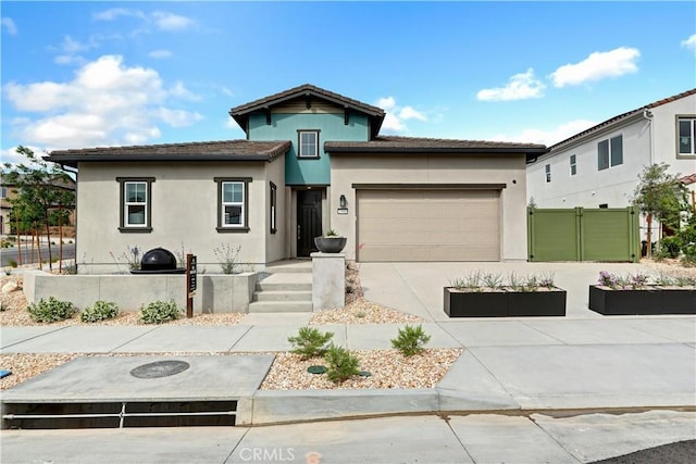 17148 Kent St, Hesperia, CA 92345 - view of front facade with concrete driveway, stucco siding, and a garage