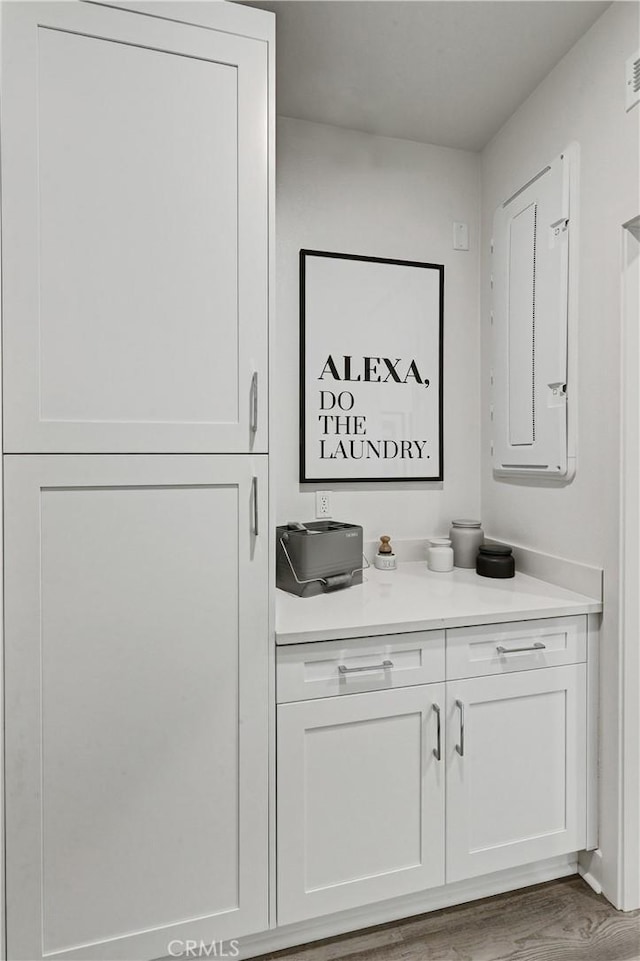 17148 Kent St, Hesperia, CA 92345 - bathroom featuring electric panel, vanity, and wood finished floors