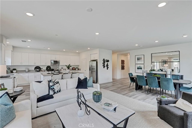 17148 Kent St, Hesperia, CA 92345 - living room with light wood-style flooring and recessed lighting