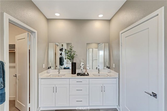 17148 Kent St, Hesperia, CA 92345 - bathroom featuring double vanity and a spacious closet