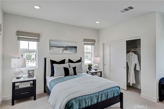 17148 Kent St, Hesperia, CA 92345 - bedroom featuring light colored carpet, multiple windows, a closet, and recessed lighting