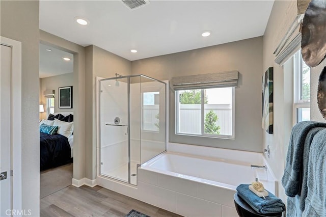 17148 Kent St, Hesperia, CA 92345 - ensuite bathroom with a bath, a shower stall, wood finished floors, and recessed lighting