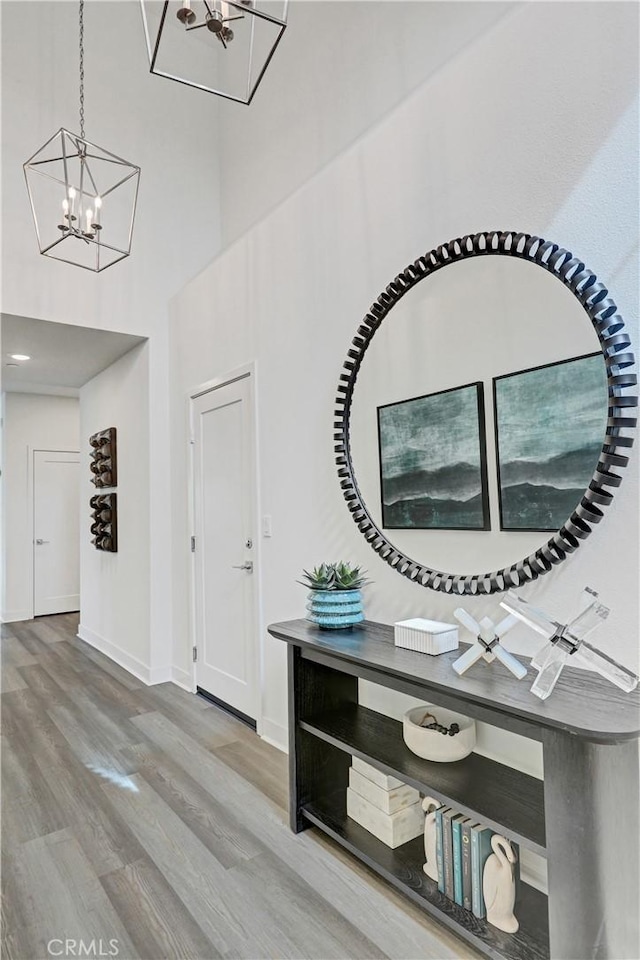 17148 Kent St, Hesperia, CA 92345 - foyer featuring a chandelier, wood finished floors, and a high ceiling