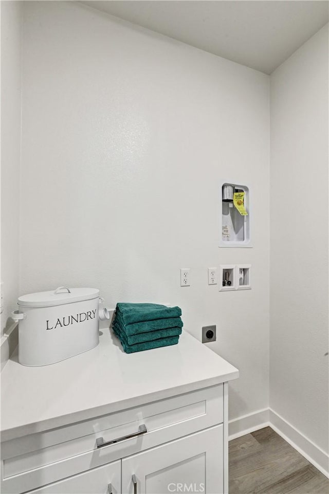 17148 Kent St, Hesperia, CA 92345 - laundry area with electric dryer hookup, dark wood-style flooring, and hookup for a washing machine