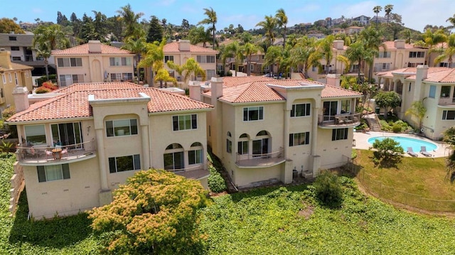 2532 Navarra Dr Unit A, Carlsbad, CA 92009 - back of house with a residential view, a tile roof, stucco siding, and a chimney
