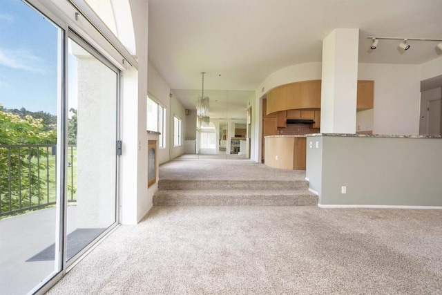 2532 Navarra Dr Unit A, Carlsbad, CA 92009 - unfurnished living room with carpet flooring and a chandelier