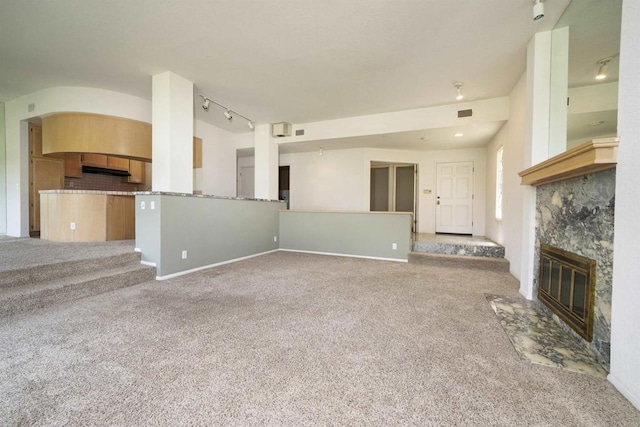 2532 Navarra Dr Unit A, Carlsbad, CA 92009 - unfurnished living room with a fireplace with flush hearth, track lighting, and carpet floors