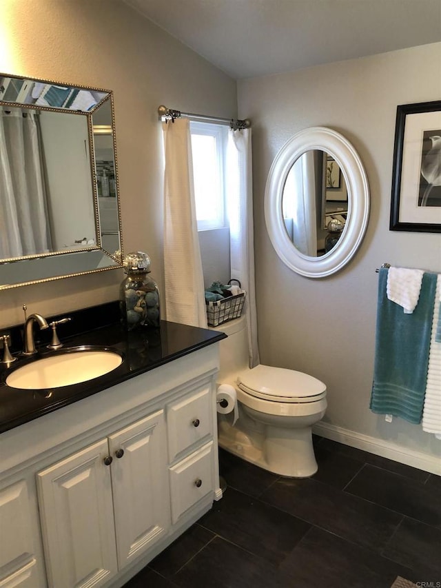 3732 Mira Pacific Dr, Oceanside, CA 92056 - bathroom with vaulted ceiling, vanity, and tile patterned floors