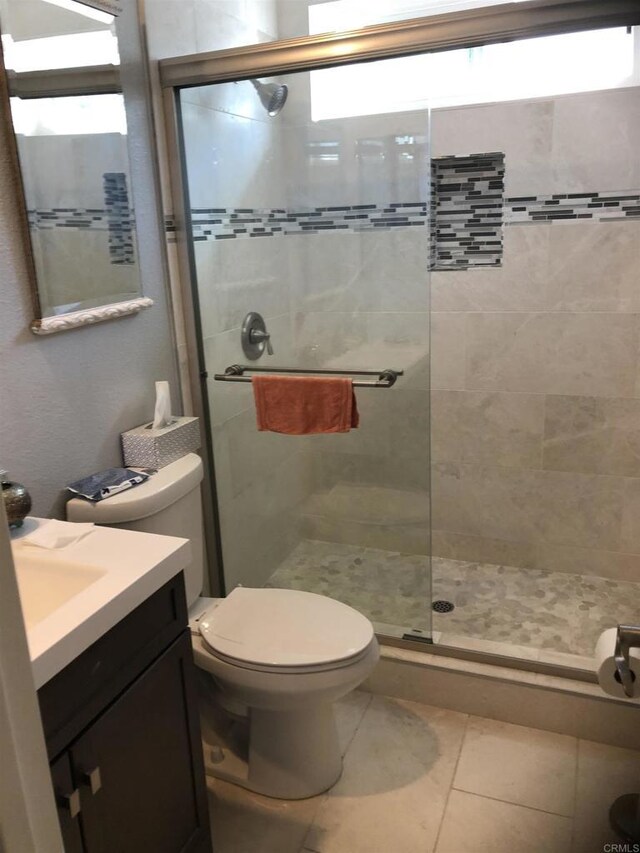 3732 Mira Pacific Dr, Oceanside, CA 92056 - full bathroom with a shower stall, vanity, and tile patterned flooring
