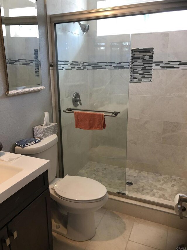 3732 Mira Pacific Dr, Oceanside, CA 92056 - bathroom featuring tiled shower, vanity, and tile patterned floors