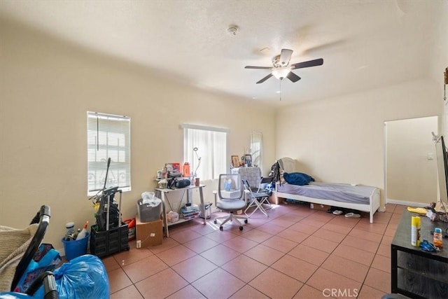 1148 E 43rd, Los Angeles, CA 90011 - bedroom with multiple windows, light tile patterned floors, and ceiling fan