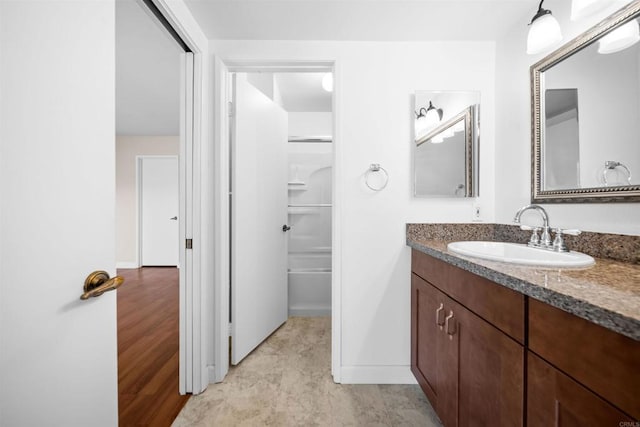 1087 Shadowridge Dr Unit 101, Vista, CA 92081 - full bathroom featuring vanity and baseboards