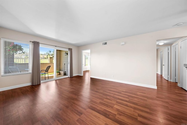 1087 Shadowridge Dr Unit 101, Vista, CA 92081 - unfurnished living room with baseboards and wood finished floors