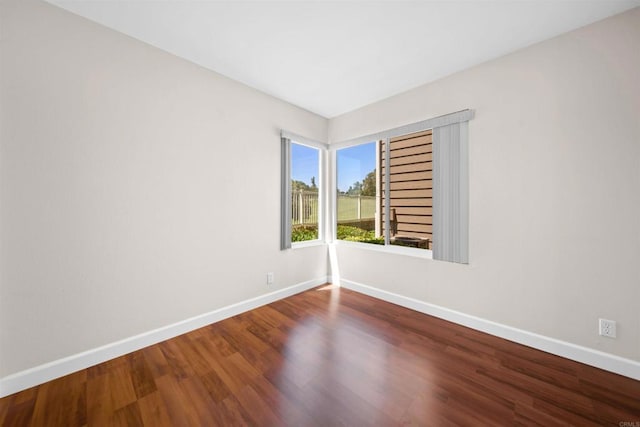 1087 Shadowridge Dr Unit 101, Vista, CA 92081 - empty room featuring baseboards and wood finished floors