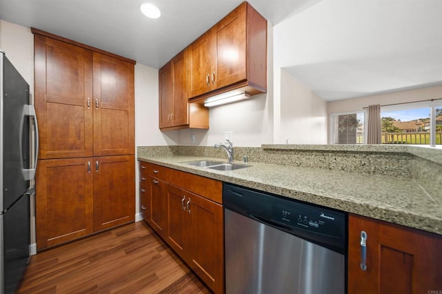 1087 Shadowridge Dr Unit 101, Vista, CA 92081 - kitchen with stainless steel appliances, dark wood-style flooring, light stone countertops, brown cabinets, and recessed lighting