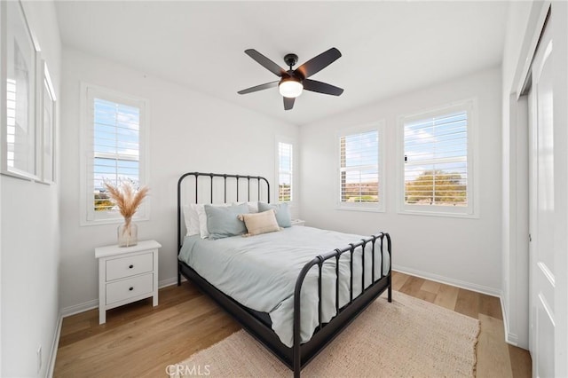 32067 Dawning Rdg, Temecula, CA 92591 - bedroom with multiple windows, light wood finished floors, and a ceiling fan