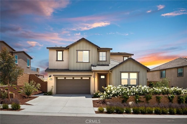 32067 Dawning Rdg, Temecula, CA 92591 - view of front facade with board and batten siding, driveway, and an attached garage