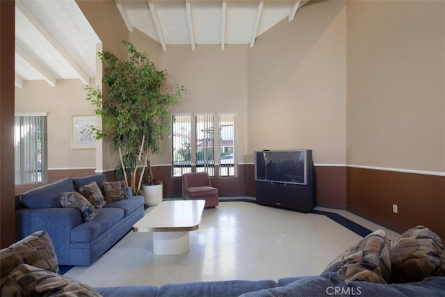 43195 Andrade Ave Unit K, Hemet, CA 92544 - living area featuring beamed ceiling, wainscoting, and high vaulted ceiling