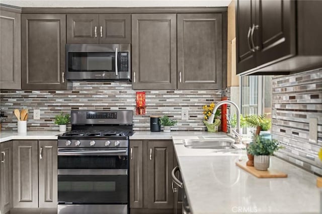 439 Acaso Dr, Walnut, CA 91789 - kitchen with appliances with stainless steel finishes, dark brown cabinets, light countertops, and decorative backsplash