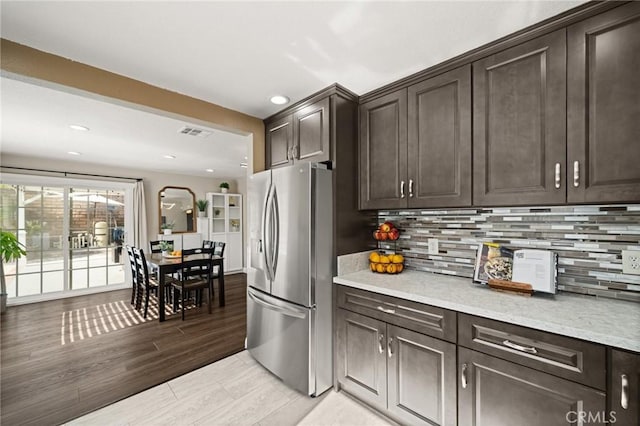 439 Acaso Dr, Walnut, CA 91789 - kitchen featuring stainless steel fridge, dark brown cabinetry, backsplash, recessed lighting, and light wood-type flooring