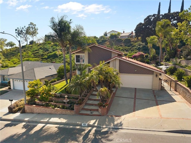 439 Acaso Dr, Walnut, CA 91789 - view of front of home featuring concrete driveway, a garage, and stucco siding