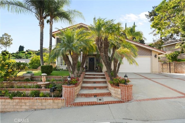 439 Acaso Dr, Walnut, CA 91789 - view of front facade featuring concrete driveway, an attached garage, and stucco siding