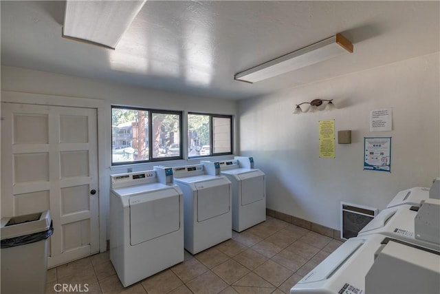 362 Old Mammoth Rd Unit 47, Mammoth Lakes, CA 93546 - shared laundry room with washing machine and dryer and light tile patterned floors