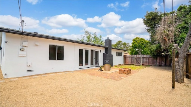1466 Balboa St, San Luis Obispo, CA 93405 - back of property with french doors, a chimney, and stucco siding