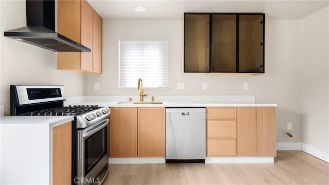 1466 Balboa St, San Luis Obispo, CA 93405 - kitchen featuring stainless steel appliances, wall chimney exhaust hood, light wood-style flooring, and light countertops