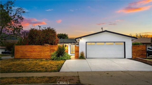 1466 Balboa St, San Luis Obispo, CA 93405 - view of front of house featuring concrete driveway, an attached garage, and stucco siding