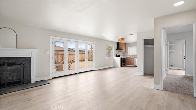 1466 Balboa St, San Luis Obispo, CA 93405 - unfurnished living room with light wood finished floors, a fireplace with raised hearth, and recessed lighting