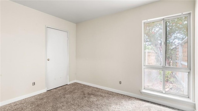 1466 Balboa St, San Luis Obispo, CA 93405 - empty room with carpet flooring and baseboards