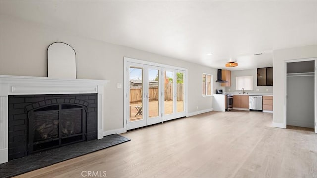 1466 Balboa St, San Luis Obispo, CA 93405 - unfurnished living room with light wood-style flooring and a fireplace with raised hearth