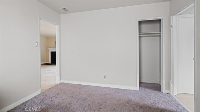 1466 Balboa St, San Luis Obispo, CA 93405 - unfurnished bedroom featuring carpet floors, a closet, and a fireplace