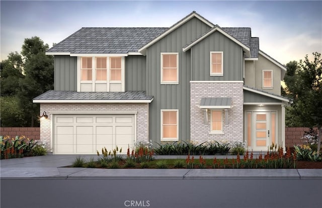 11772 Deerlake Ranch Rd, Chatsworth, CA 91311 - view of front facade featuring board and batten siding, driveway, a garage, and brick siding