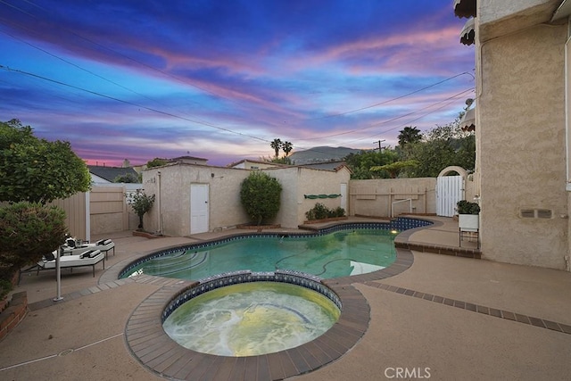 1161 N Everett St, Glendale, CA 91207 - view of swimming pool with a pool with connected hot tub, a patio, a fenced backyard, and a gate