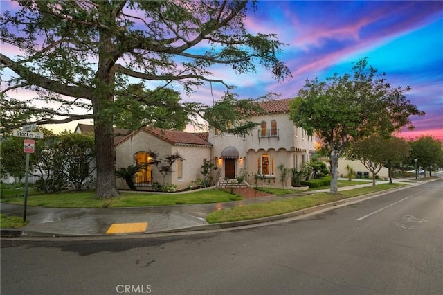 1161 N Everett St, Glendale, CA 91207 - mediterranean / spanish house with stucco siding, a front lawn, and a tile roof