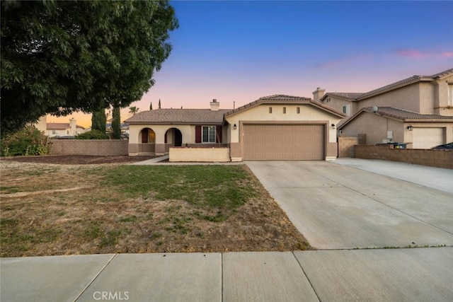 1706 Regents St, Lancaster, CA 93534 - view of front of property featuring an attached garage, stucco siding, driveway, a chimney, and a tile roof