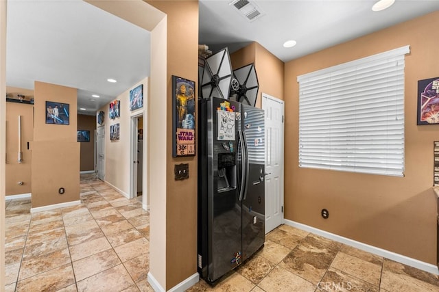 1706 Regents St, Lancaster, CA 93534 - kitchen featuring fridge with ice dispenser and light stone finish flooring