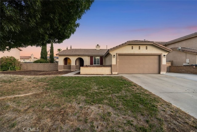 1706 Regents St, Lancaster, CA 93534 - view of front of property with an attached garage, driveway, a chimney, stucco siding, and a tile roof