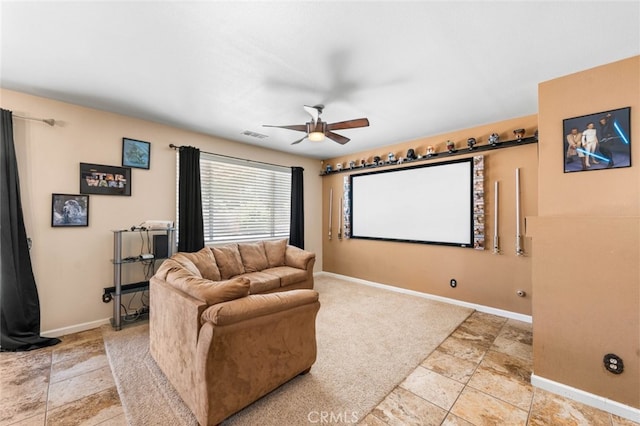 1706 Regents St, Lancaster, CA 93534 - cinema featuring ceiling fan and light stone finish flooring