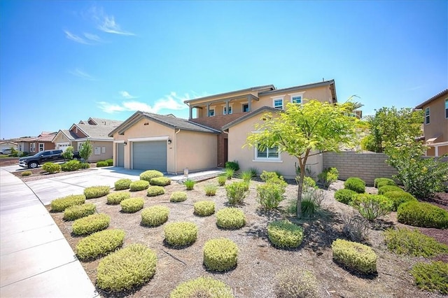 13471 Planet Ct, Riverside, CA 92503 - view of front of house with stucco siding, a garage, driveway, and a residential view